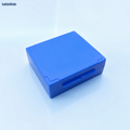 Blue standard 25-slide microscope slide storage box on a pale blue laboratory background