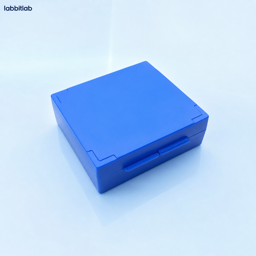 Blue standard 25-slide microscope slide storage box on a pale blue laboratory background