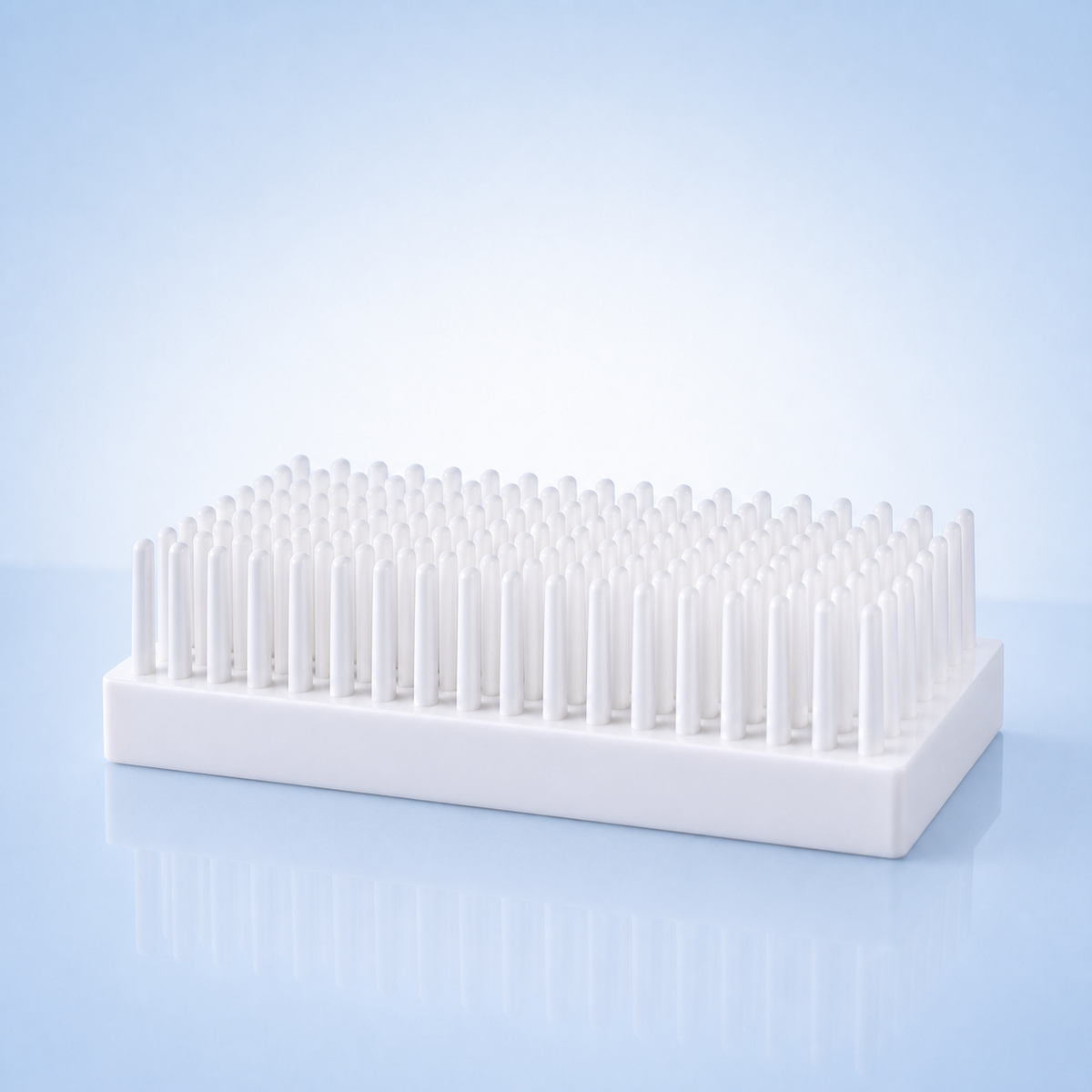 White 66-post laboratory tube drying rack for air-drying washed tubes on a laboratory bench