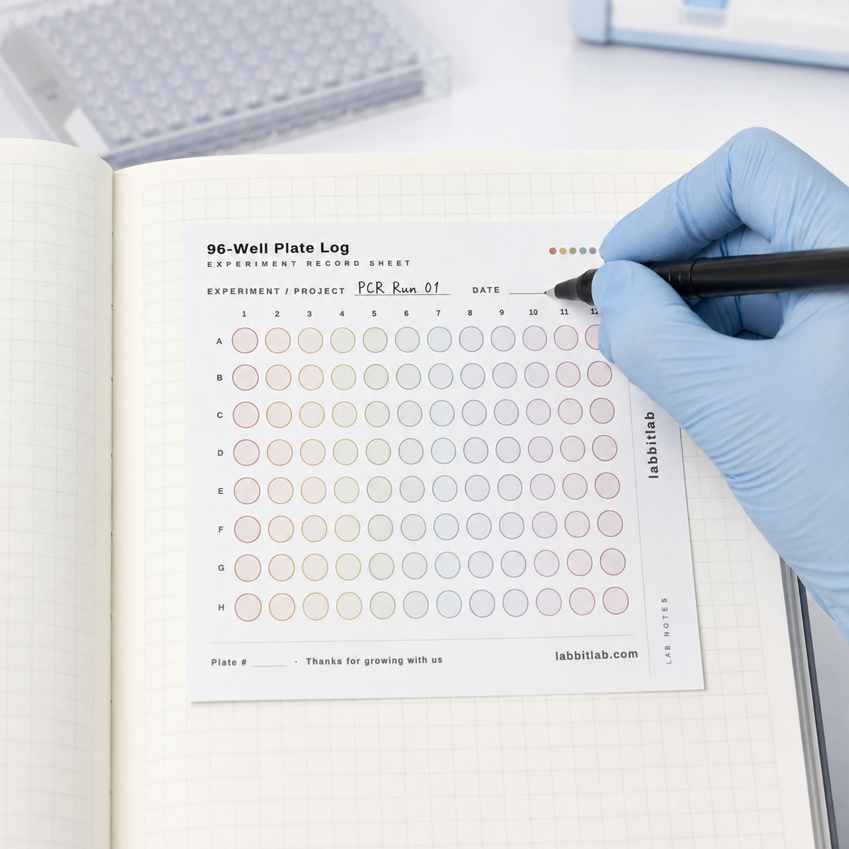 labbitlab 96-well plate log sticky note attached to a laboratory notebook for recording PCR experiment data
